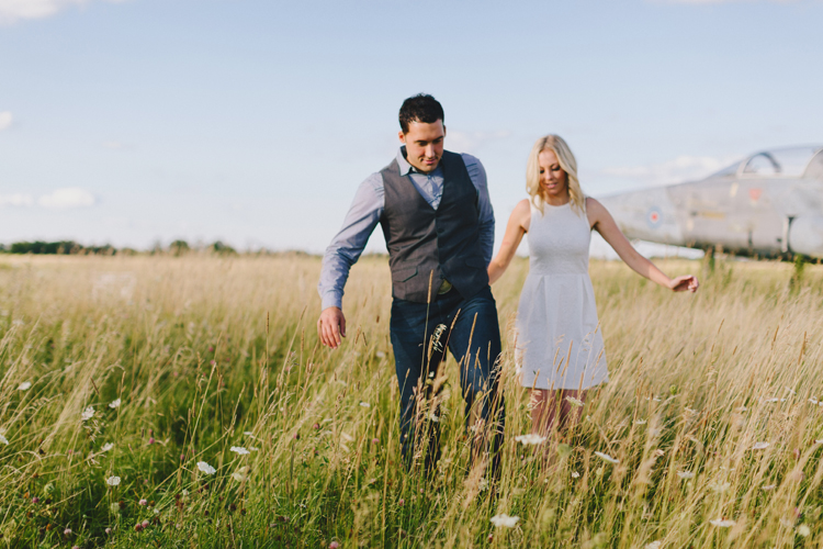 Engagement photos in a field